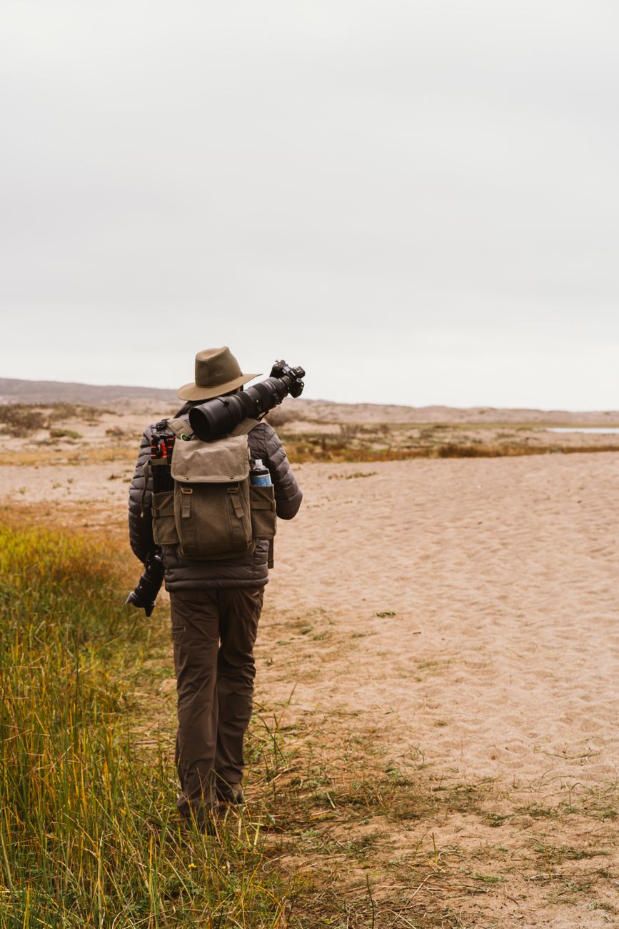 Travel photojournalist in mountains
